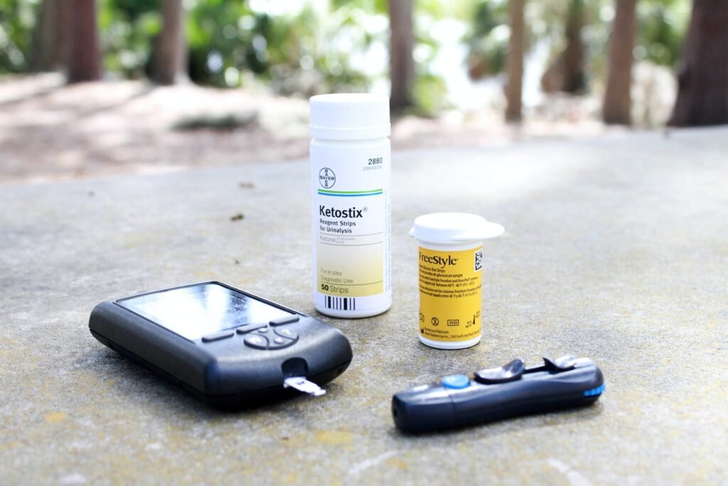 black smartphone beside white plastic bottle and black smartphone, diabetic